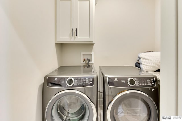18108 Locust St, Elkhorn, NE 68022 - clothes washing area featuring washing machine and dryer and cabinet space