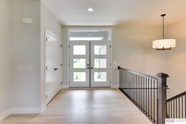 18108 Locust St, Elkhorn, NE 68022 - entryway featuring light wood-style floors, baseboards, and recessed lighting