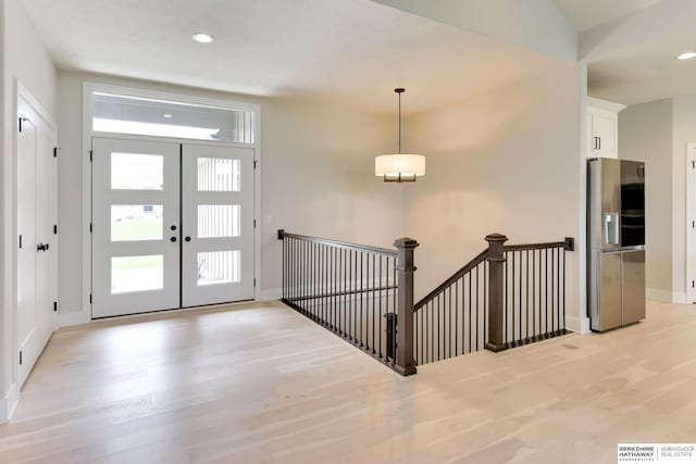 18108 Locust St, Elkhorn, NE 68022 - entryway with light wood finished floors, baseboards, and recessed lighting