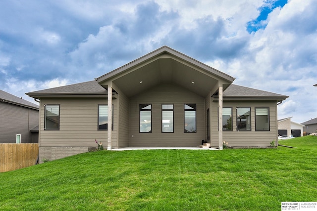 18108 Locust St, Elkhorn, NE 68022 - back of property featuring a patio and roof with shingles