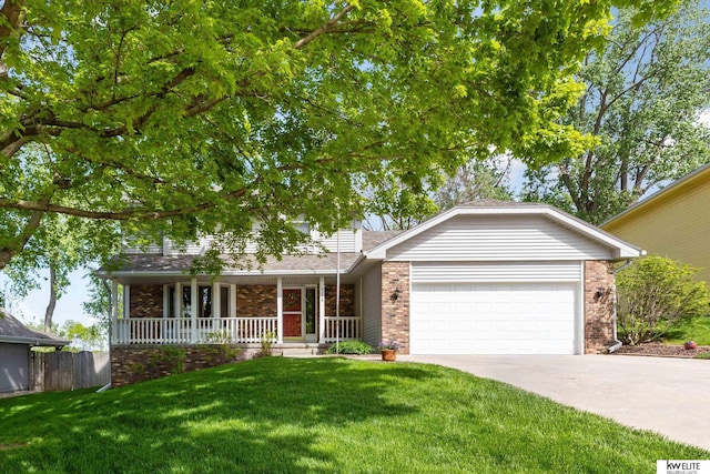 6219 S 79th Cir, Ralston, NE 68127 - view of front facade with brick siding, covered porch, an attached garage, and driveway