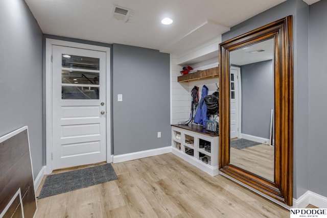 mudroom featuring light wood-style floors, baseboards, and recessed lighting