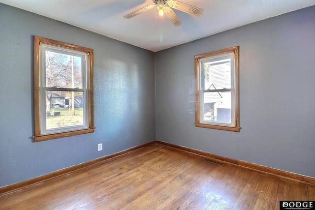 1807 N Platte Ave, Fremont, NE 68025 - empty room with wood finished floors, baseboards, and ceiling fan