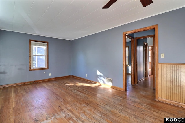1807 N Platte Ave, Fremont, NE 68025 - unfurnished room with ceiling fan, wood finished floors, crown molding, and baseboards