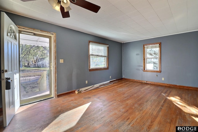 1807 N Platte Ave, Fremont, NE 68025 - spare room with plenty of natural light, hardwood / wood-style flooring, a ceiling fan, and a baseboard radiator