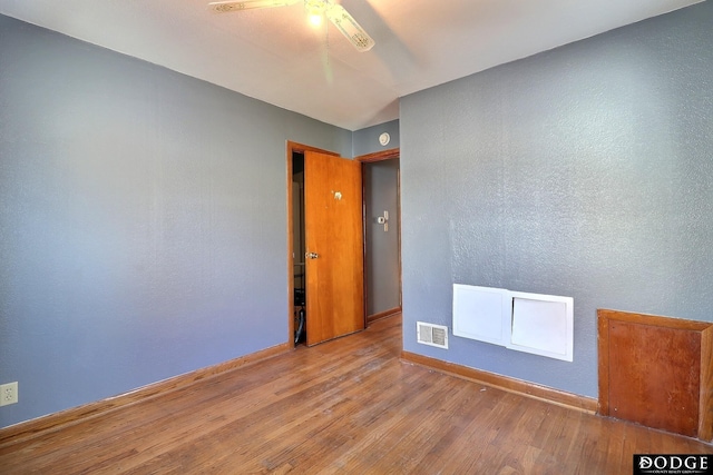 1807 N Platte Ave, Fremont, NE 68025 - unfurnished room with ceiling fan, wood finished floors, and baseboards