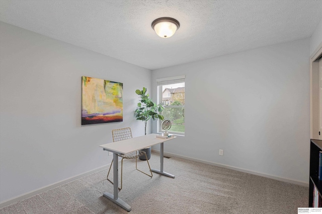 18652 Van Camp Dr, Omaha, NE 68130 - office area featuring carpet floors, a textured ceiling, and baseboards
