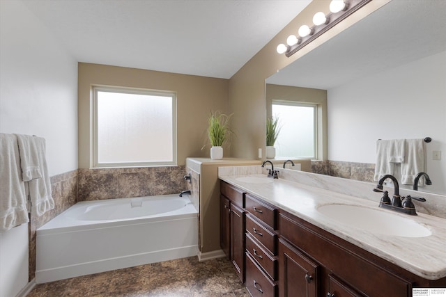 18652 Van Camp Dr, Omaha, NE 68130 - bathroom featuring double vanity and a bath