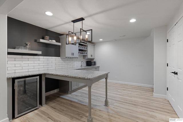 18652 Van Camp Dr, Omaha, NE 68130 - kitchen featuring open shelves, beverage cooler, decorative backsplash, baseboards, and recessed lighting