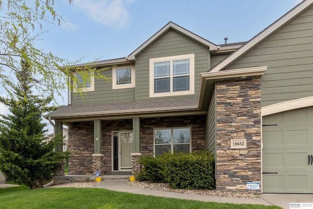 18652 Van Camp Dr, Omaha, NE 68130 - view of front of property with stone siding and a porch