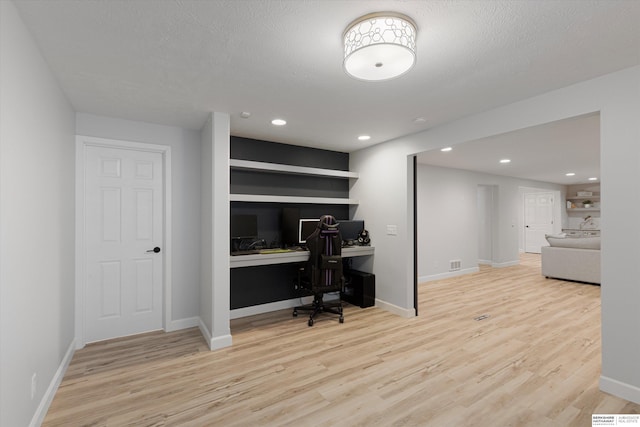 18652 Van Camp Dr, Omaha, NE 68130 - home office featuring wood finished floors, baseboards, and recessed lighting