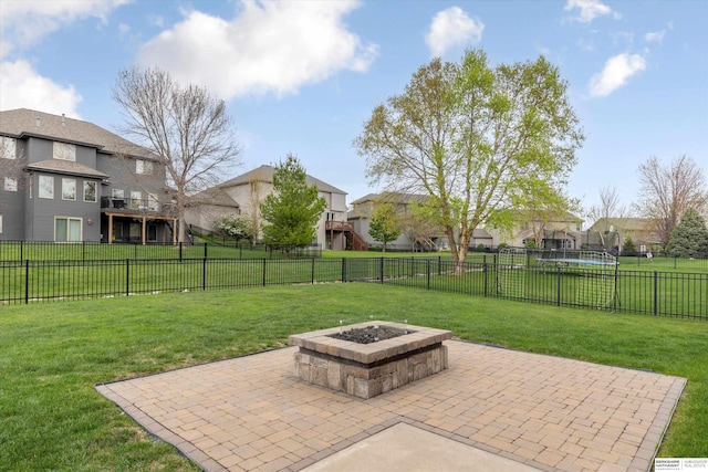 18652 Van Camp Dr, Omaha, NE 68130 - view of patio / terrace featuring a fire pit, a residential view, and a trampoline