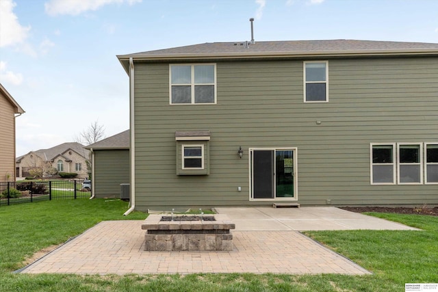 18652 Van Camp Dr, Omaha, NE 68130 - back of property featuring an outdoor fire pit, a patio area, and central AC