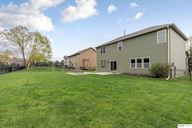 18652 Van Camp Dr, Omaha, NE 68130 - back of house featuring a patio area and a fire pit