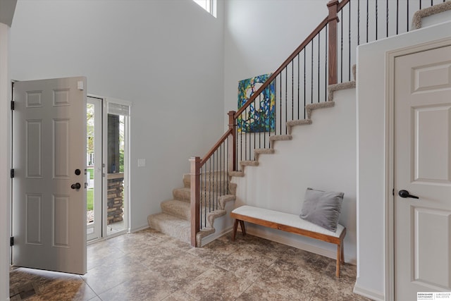 18652 Van Camp Dr, Omaha, NE 68130 - entryway featuring a towering ceiling, plenty of natural light, and stairs