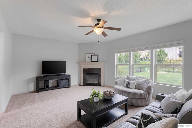 18652 Van Camp Dr, Omaha, NE 68130 - carpeted living room with ceiling fan and a high end fireplace