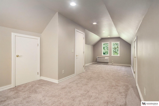 1125 Stone Creek Dr, Blair, NE 68008 - additional living space featuring vaulted ceiling, carpet, an AC wall unit, recessed lighting, and baseboards