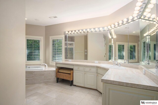 1125 Stone Creek Dr, Blair, NE 68008 - bathroom featuring tile patterned floors, a bath, and vanity