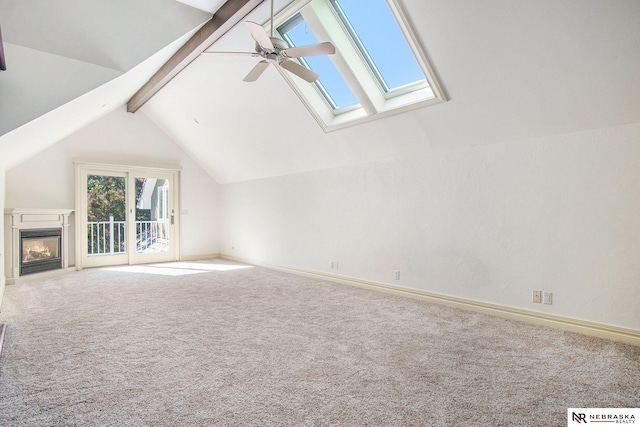 1125 Stone Creek Dr, Blair, NE 68008 - unfurnished living room featuring a ceiling fan, a skylight, carpet, and baseboards