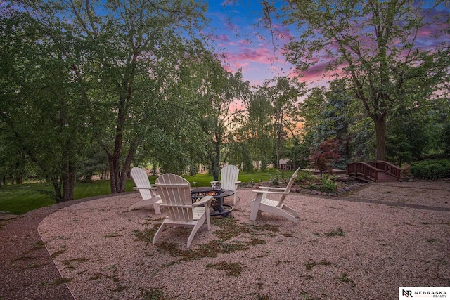1125 Stone Creek Dr, Blair, NE 68008 - yard at dusk featuring a fire pit