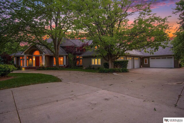 1125 Stone Creek Dr, Blair, NE 68008 - view of front of home featuring driveway, a garage, and a tile roof