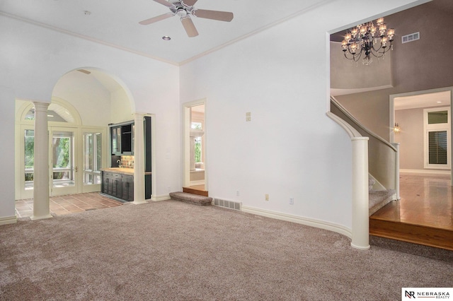 1125 Stone Creek Dr, Blair, NE 68008 - unfurnished living room with light colored carpet, stairs, ornamental molding, a high ceiling, and a ceiling fan