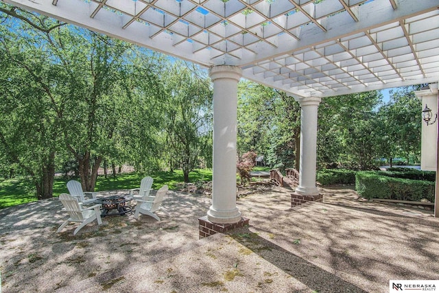 1125 Stone Creek Dr, Blair, NE 68008 - view of patio / terrace featuring a pergola, an outdoor fire pit, and view of scattered trees