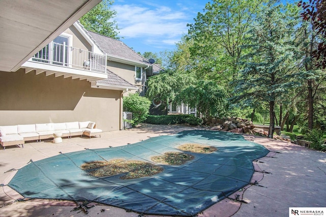1125 Stone Creek Dr, Blair, NE 68008 - view of swimming pool featuring a covered pool and a patio area