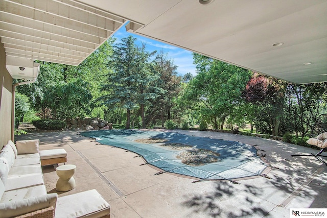 1125 Stone Creek Dr, Blair, NE 68008 - view of pool with a patio, a covered pool, and view of scattered trees
