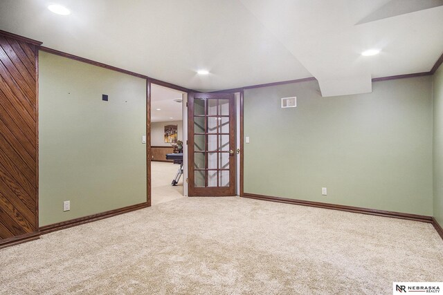 1125 Stone Creek Dr, Blair, NE 68008 - unfurnished room with carpet floors, crown molding, baseboards, recessed lighting, and wood walls