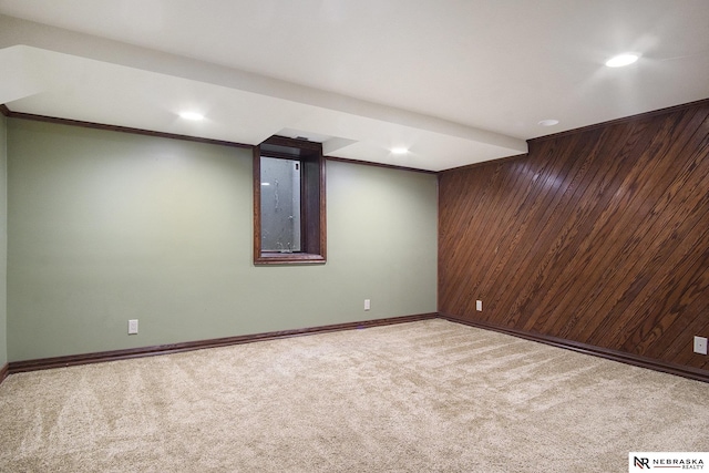 1125 Stone Creek Dr, Blair, NE 68008 - finished below grade area featuring wood walls, carpet, recessed lighting, and baseboards