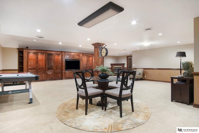 1125 Stone Creek Dr, Blair, NE 68008 - dining room with light carpet, recessed lighting, and a fireplace