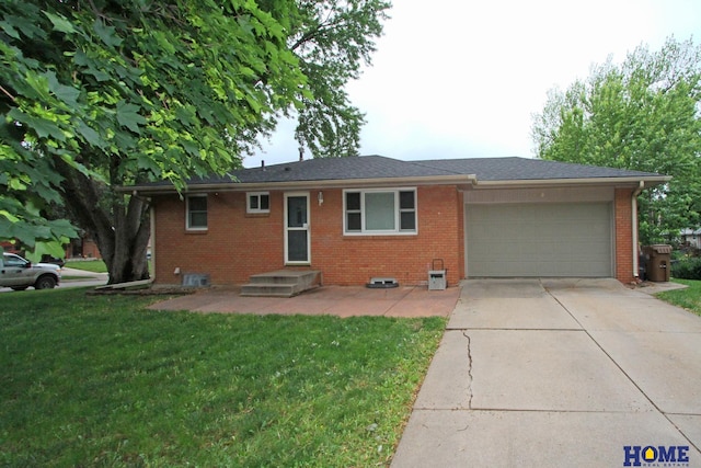 1701 N 73rd St, Lincoln, NE 68505 - ranch-style house featuring a garage, a front yard, driveway, and brick siding