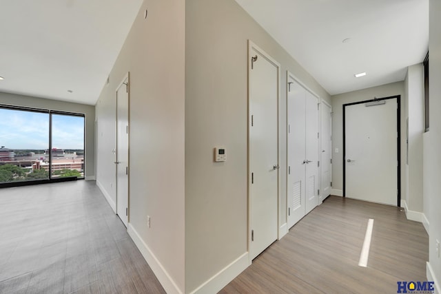 1125 Q St Unit 1401, Lincoln, NE 68508 - corridor with baseboards and wood finished floors
