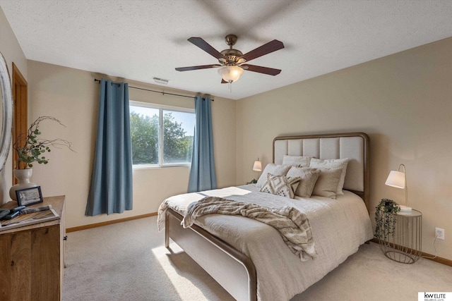 3909 N 147th St, Omaha, NE 68116 - bedroom featuring baseboards, light colored carpet, a ceiling fan, and a textured ceiling