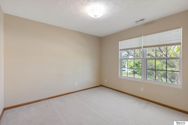 3909 N 147th St, Omaha, NE 68116 - unfurnished room featuring baseboards, light colored carpet, and a textured ceiling