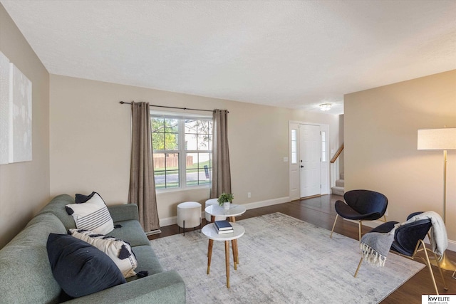 3909 N 147th St, Omaha, NE 68116 - living room with wood finished floors, stairway, and baseboards