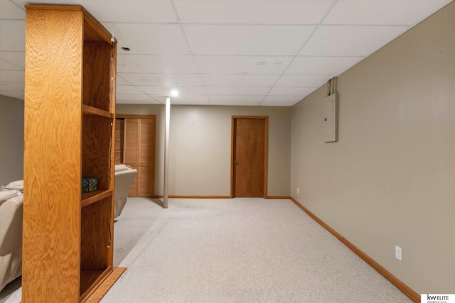 3909 N 147th St, Omaha, NE 68116 - finished below grade area featuring a drop ceiling, carpet flooring, baseboards, and electric panel