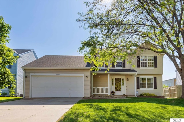 3909 N 147th St, Omaha, NE 68116 - traditional home with an attached garage, concrete driveway, and covered porch