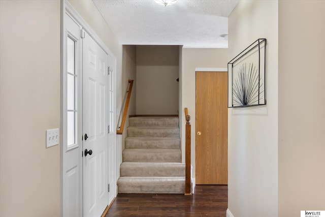 3909 N 147th St, Omaha, NE 68116 - stairway with wood finished floors and a textured ceiling