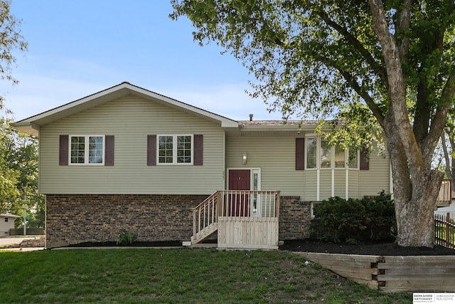 221 Lindale Cir, Hickman, NE 68372 - view of front of home featuring brick siding and a front yard