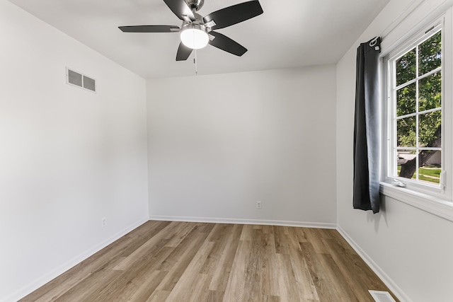 221 Lindale Cir, Hickman, NE 68372 - empty room with light wood-style floors, healthy amount of natural light, baseboards, and ceiling fan