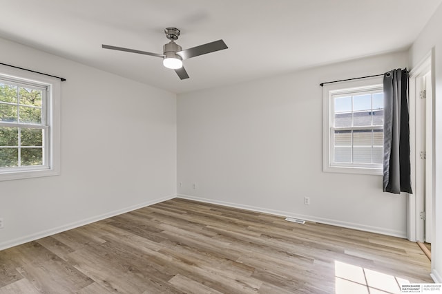 221 Lindale Cir, Hickman, NE 68372 - empty room with light wood finished floors, a ceiling fan, and baseboards
