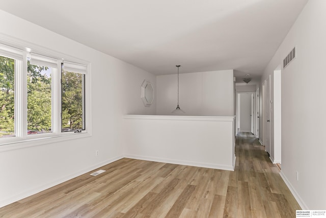 221 Lindale Cir, Hickman, NE 68372 - spare room featuring light wood-type flooring and baseboards