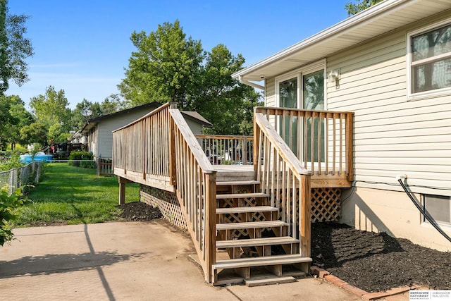 221 Lindale Cir, Hickman, NE 68372 - wooden terrace with stairs and a patio area