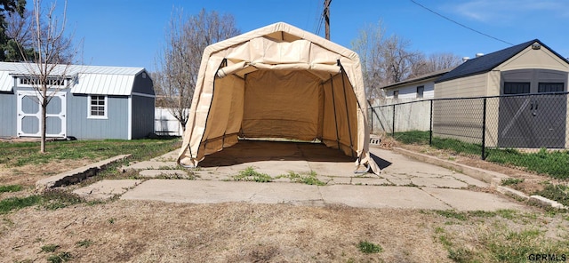 942 Manatt St, Lincoln, NE 68521 - view of shed with a carport and fence