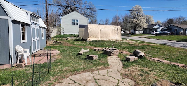 942 Manatt St, Lincoln, NE 68521 - view of yard featuring a fire pit and a residential view