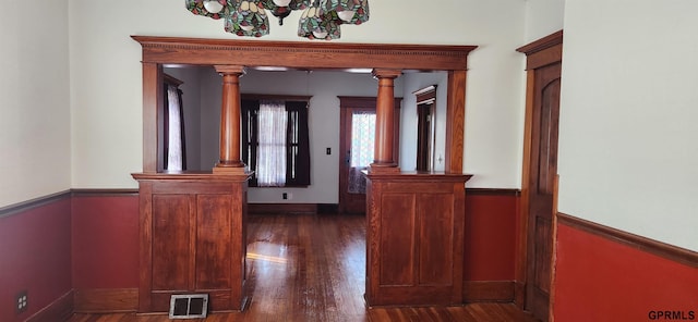 942 Manatt St, Lincoln, NE 68521 - hallway featuring wood finished floors, baseboards, and decorative columns