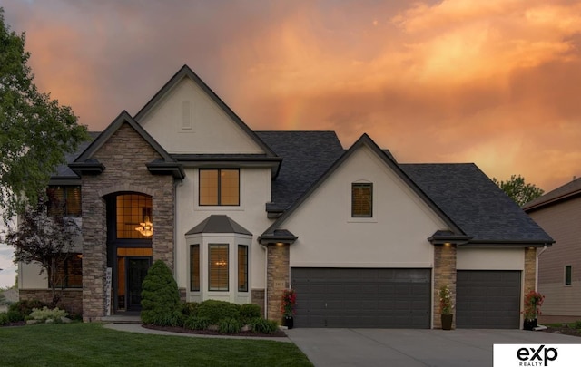 1411 S 195th St, Omaha, NE 68130 - french provincial home with stucco siding, stone siding, driveway, and a front lawn
