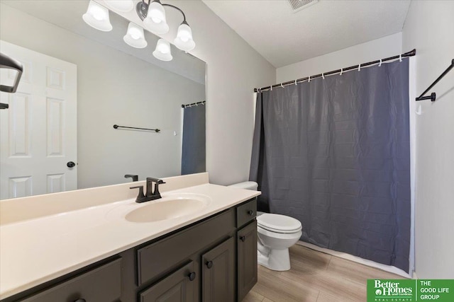 bathroom with wood finished floors, vanity, toilet, and a shower with curtain